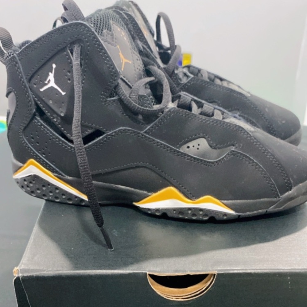 Jordan Black and Gold Sneakers Modern Sporty Silhouette